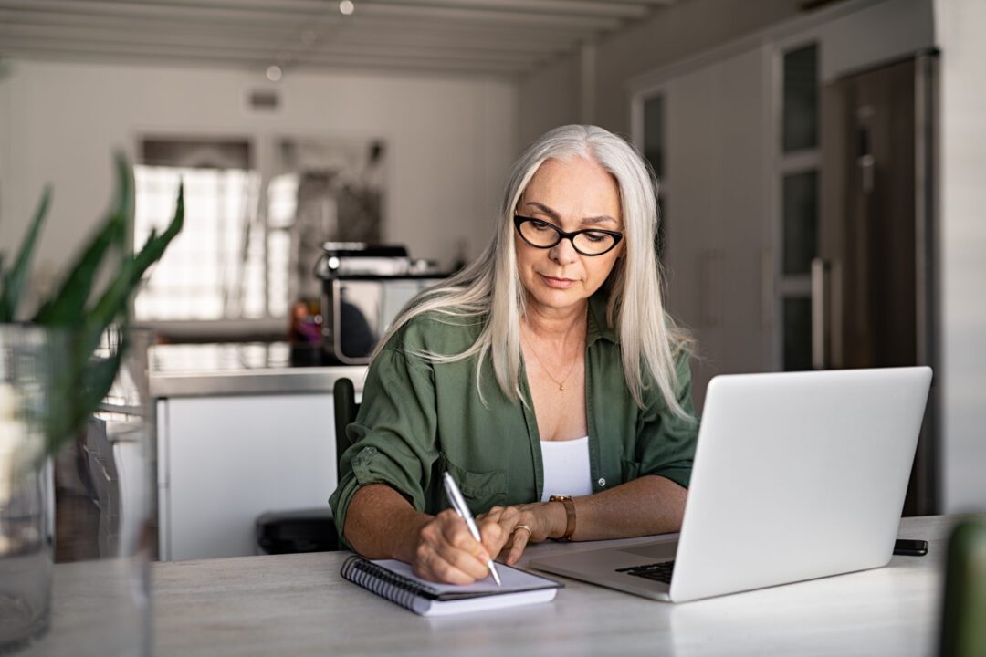 Woman researching CareSource Medicaid plan options online