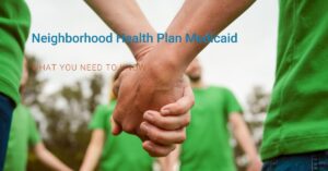 People in green shirts holding hands who are all enrolled in Neighborhood Health Plan Medicaid and on a discussion of the benefits of it